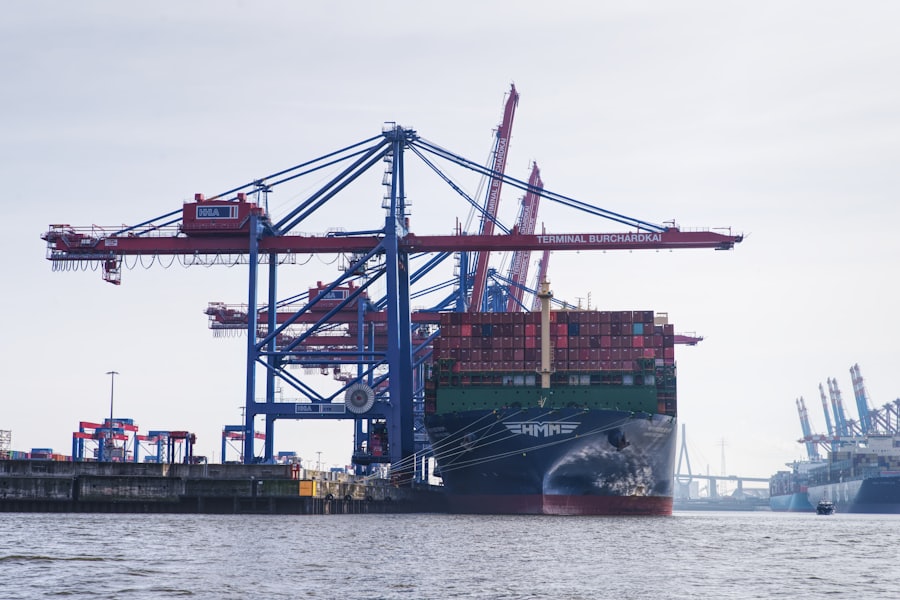 Container ship berthed at a terminal quay under gantry cranes