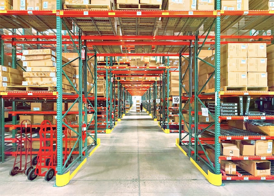 Warehouse aisle lined with racking and palletised boxes
